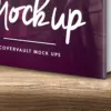 موکاپ کتاب با جلد سخت و آیفون 6 روی میز چوبی 3